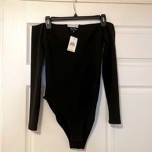 Long sleeved, off shoulder black body suit